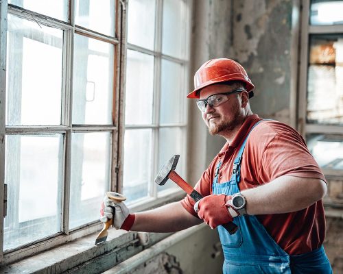 builder-on-a-construction-site-working-on-a-brick-resize.jpg